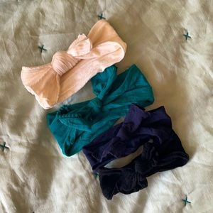 Gently used bundle of four Baby Bling Headbands in Blue Tones